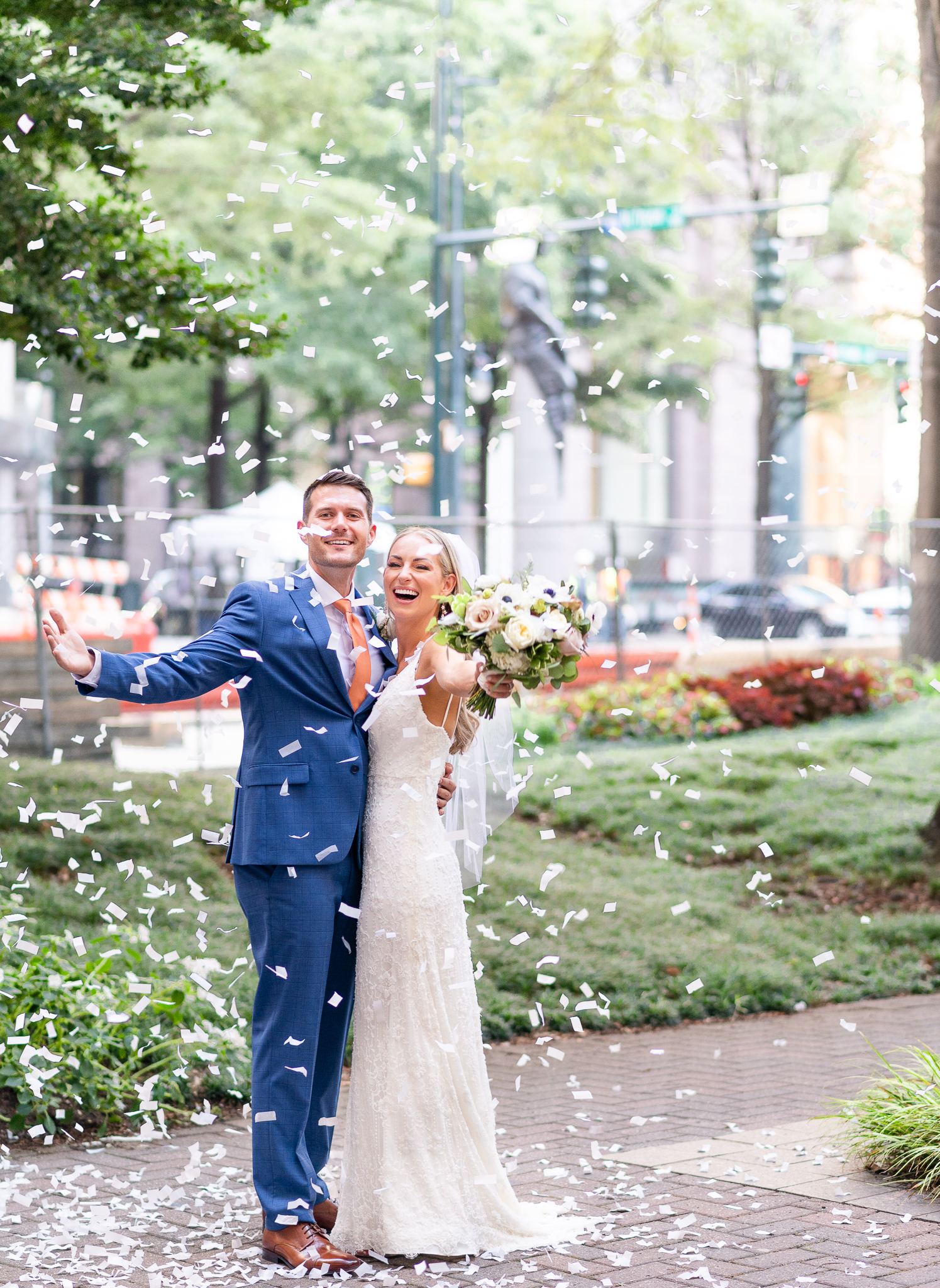 bride and groom celebrating with confetti